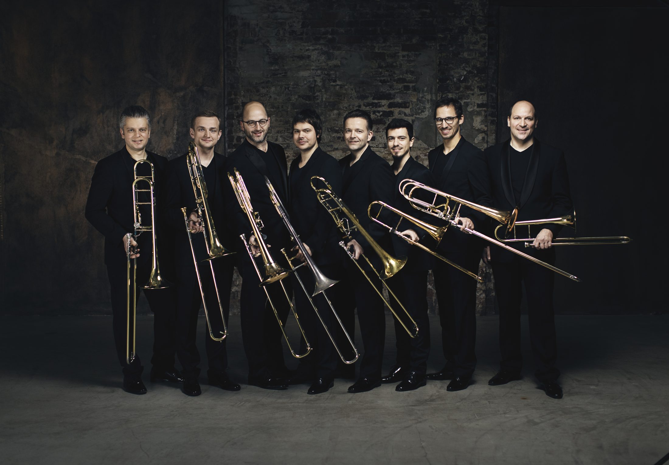 Trombone Unit Hannover ensemble holding trombones
